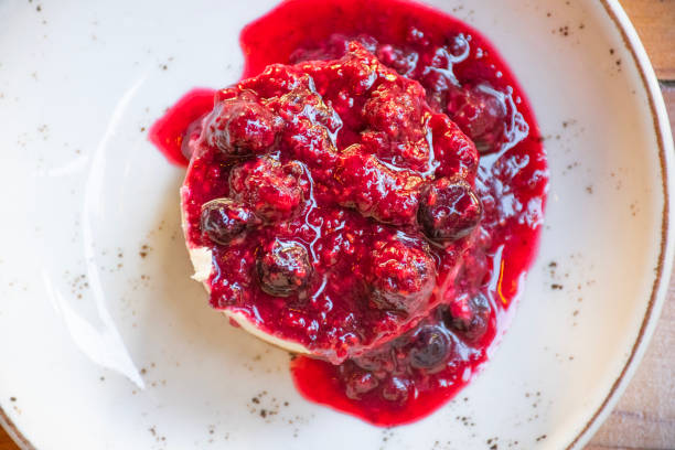 istock delicious cheesecake dessert with berry jam on restaurant table close-up top view 1947336805