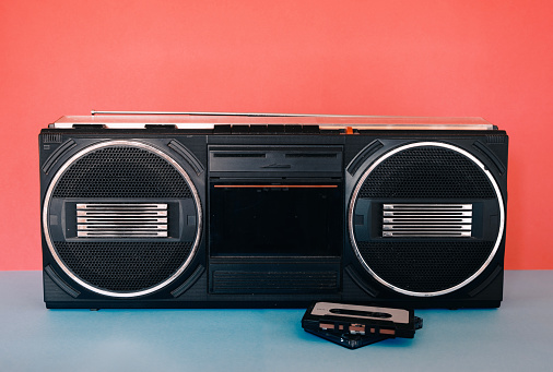 Front View of a Vintage Boom Box Cassette Tape Player Isolated on White Background.