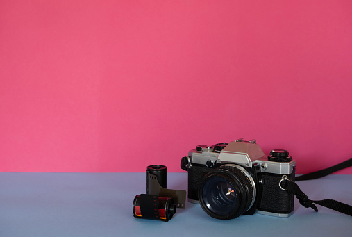 A SLR 35mm camera with two rolls of unused film