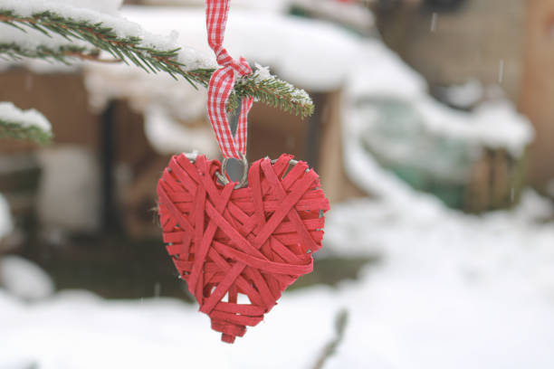 Heart decoration made of knitted brown wicker