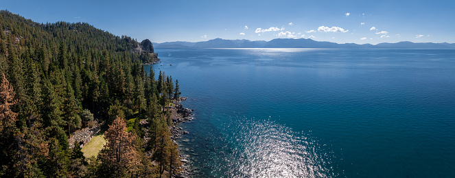 Beautiful aerial view of the Tahoe lake from above in California, USA. Wild forests, fresh air and mountains of California.