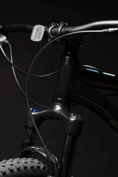 istock Close up of a bicycle against black background 1947417283