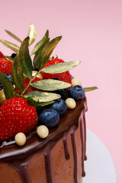 istock Chocolate cake in chocolate glaze with strawberries 1947419799
