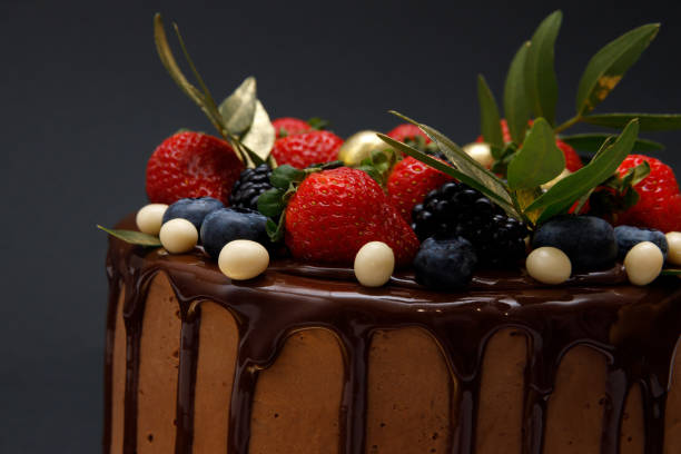 istock Chocolate cake in chocolate glaze with strawberries 1947419948