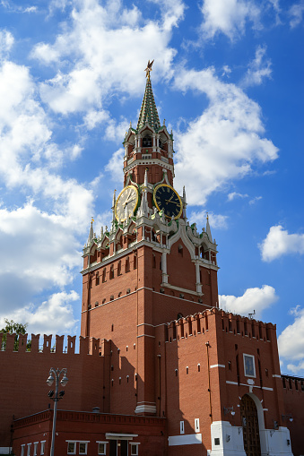 14.09.2023, Russia, Moscow, Red Square, Moscow Kremlin. The Spasskaya Tower was photographed against the blue sky. View from Vasilevsky descent.
