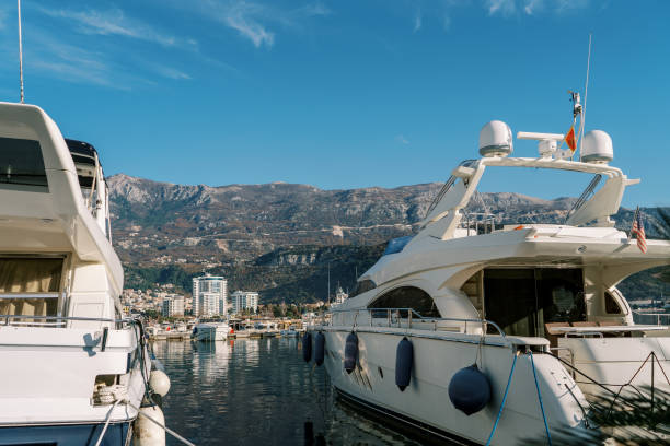 istock Single-deck yachts moored off the coast overlooking the mountains 1947429750