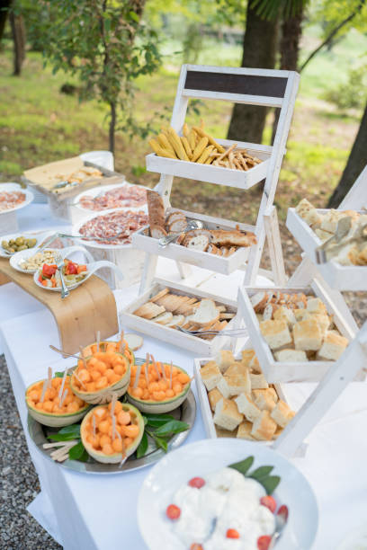 istock Festive set table with different dishes in a green forest 1947441187