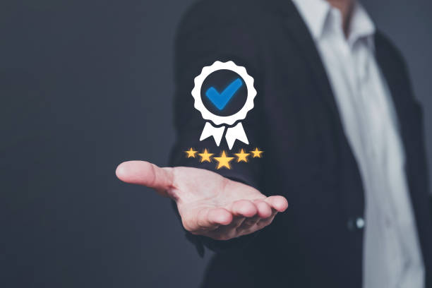 istock Businessman hand is having a high standard service proposal to customers, Customer satisfaction evaluation concepts, improving service quality, excellent service, with a perfect score of five stars. 1947462847
