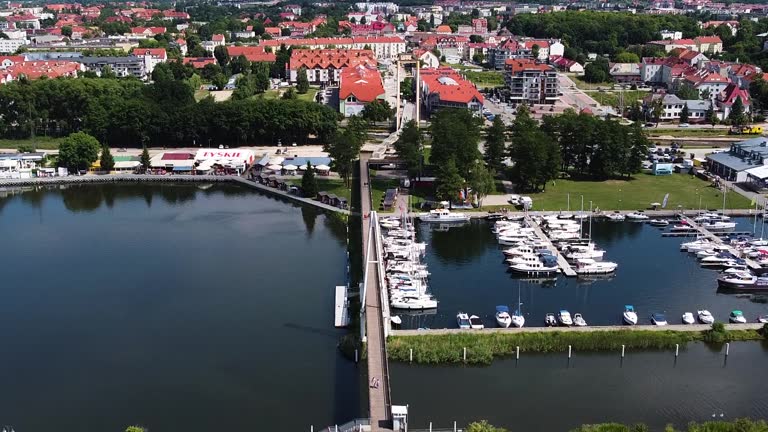 Gizycko township and small marina with boats and yachts, aerial view