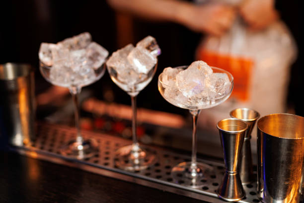 istock Glasses with ice while preparing an alcoholic cocktail. 1947470669