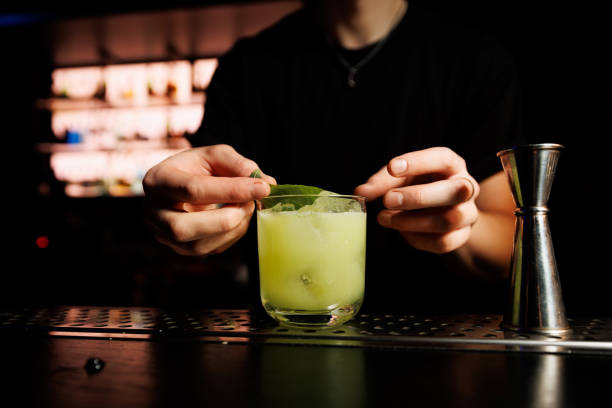 istock Bartender making alcohol cocktail in a bar, close-Up. 1947470673