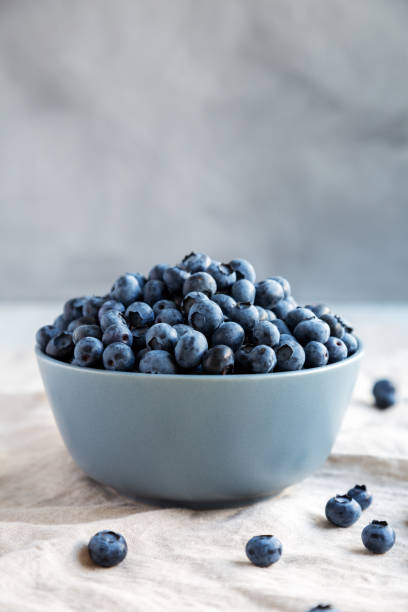 istock Raw Organic Blueberries in a Bowl, side view. 1947472219