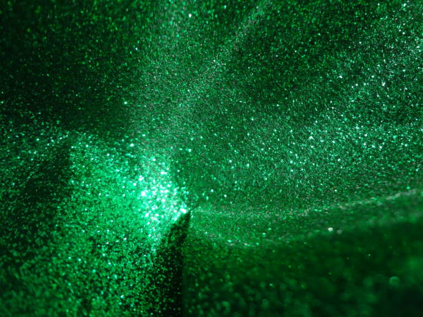 istock Splashing light green glitter background 1947480987