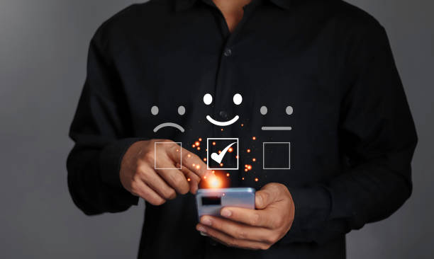 istock Businessman touching virtual screen on happy smiley face icon to give service satisfaction and customer satisfaction scores. 1947489711