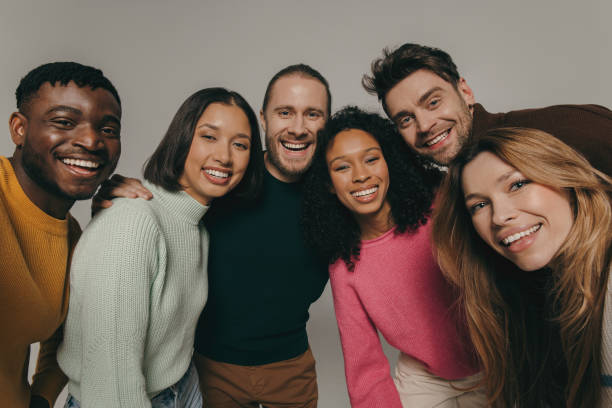 istock Joyful young people bonding and smiling while making selfie on beige background together 1947507612