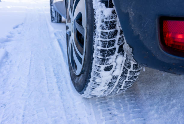 istock Winter tires with tread in the snow 1947517902