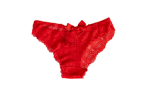 Red lace women's panties , isolated on white background. Luxurious elegant sexy blue women's thong, close-up. fashion lingerie
