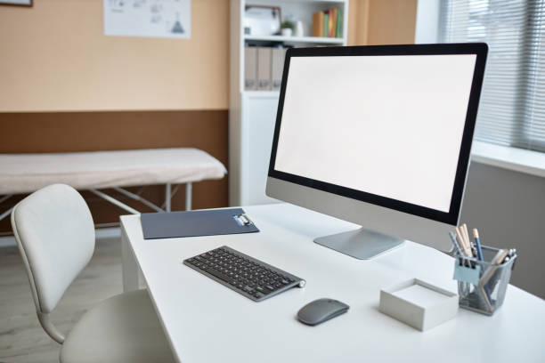 istock Mockup White Screen Computer Monitor in Modern Clinic 1947526994