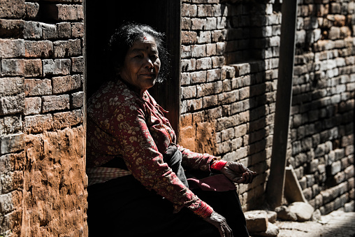 Kathmandu, Nepal- April 20,2023 : Portrait of older Nepalese in Patan Durbar Square.