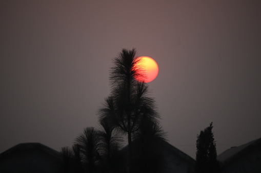 An image of a beautiful red sunset over the dusty sky..