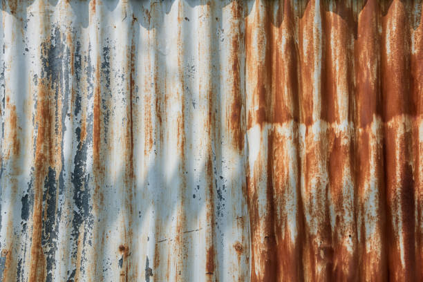 istock Rusty iron zinc or old corrugated metal wall textured background 1947630133