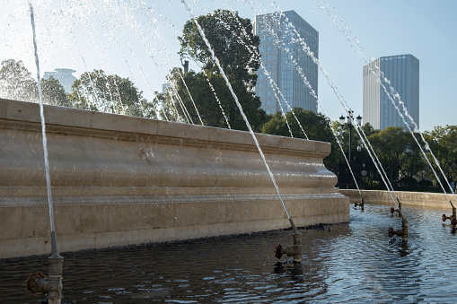 Open-air fountain under modern office building