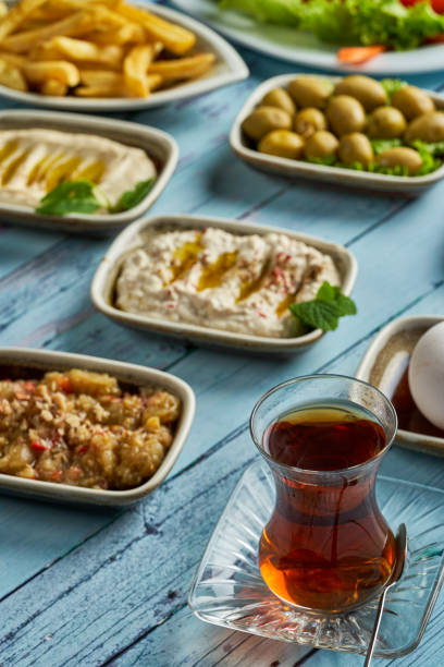 istock Traditional Turkish breakfast with tea on blue background 1947778026