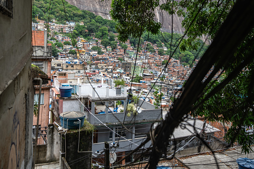 View of Rocinha with power lines, the largest Favela in Rio, de Janerio, Brazil from the top of the hill