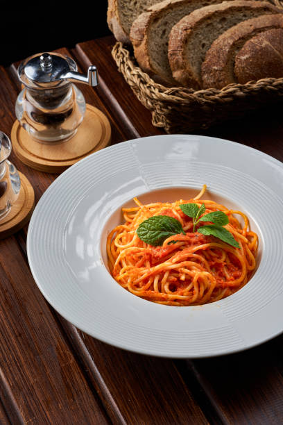 istock Bolognese pasta dish with wheat bread in the background 1947811119
