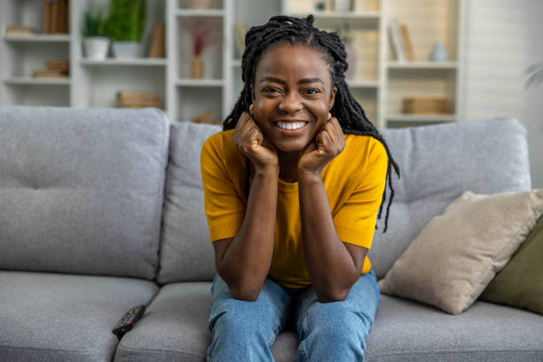 istock Cute smiling african american woman looking contented 1947829061