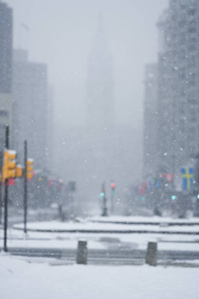 Winter in Center city Philadelphia during snow storm. City hall.