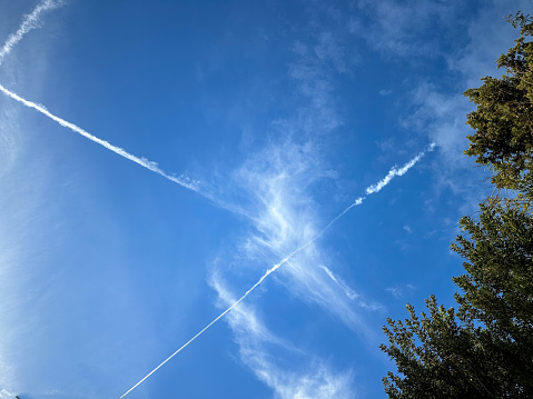 Sky landscape marked by lines of airplanes