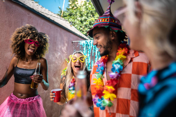 istock Friends celebrating Carnival at home 1947948903