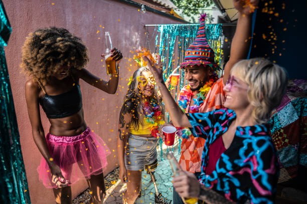 istock Friends celebrating Carnival at home 1947948904