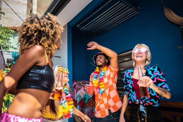 istock Friends celebrating Carnival at home 1947948905