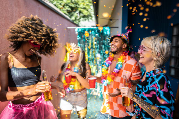 istock Friends celebrating Carnival at home 1947949417
