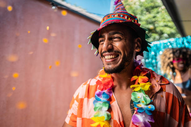 Young man enjoying Carnival at home