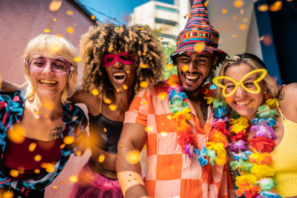 istock Friends enjoying Carnival at home 1947952028