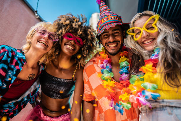 Portrait of friends enjoying Carnival at home Portrait of friends enjoying Carnival at home carnival mask women party stock pictures, royalty-free photos & images