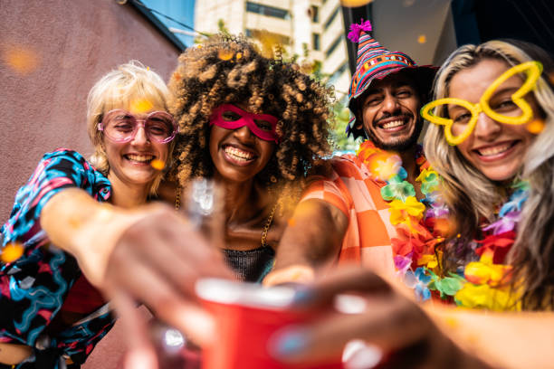 friends making a toasting during carnival celebration at home - carnival mask women party imagens e fotografias de stock