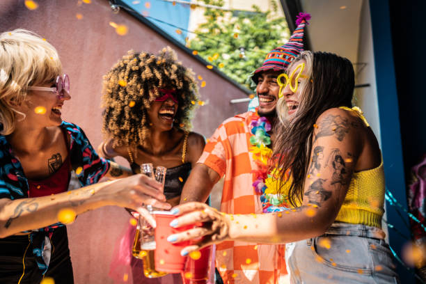 istock Friends making a toasting during Carnival celebration at home 1947952042
