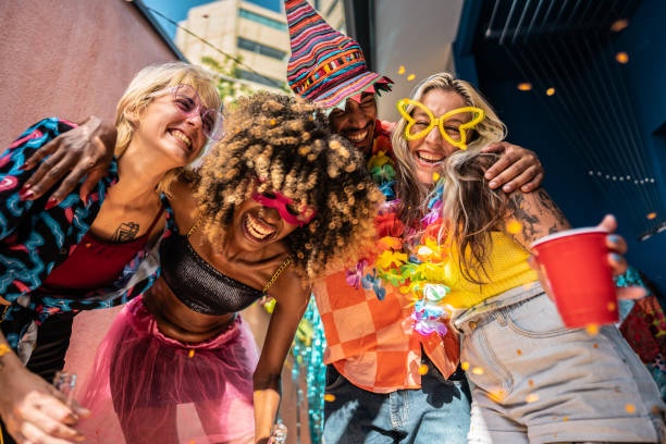 istock Friends enjoying Carnival at home 1947952547