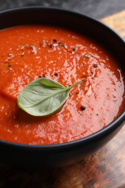 istock Delicious tomato cream soup in bowl on table, closeup 1947965204