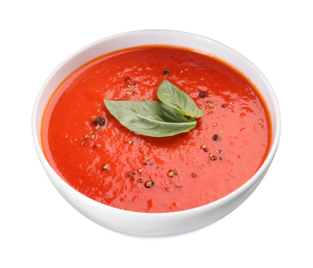 istock Delicious tomato cream soup in bowl isolated on white 1947965451
