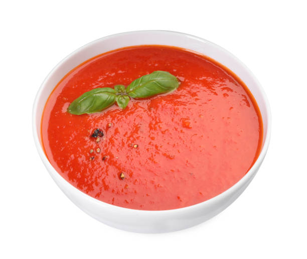 istock Delicious tomato cream soup in bowl isolated on white 1947965452