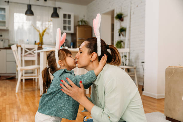istock Mother and child  having fun at home for the Easter holiday 1947967106