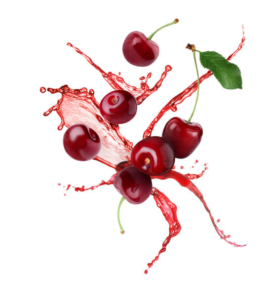 istock Cherries with splashing juice isolated on white 1947971933