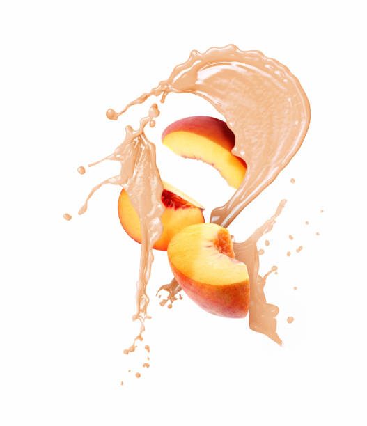 istock Peach with splashing juice isolated on white 1947972444
