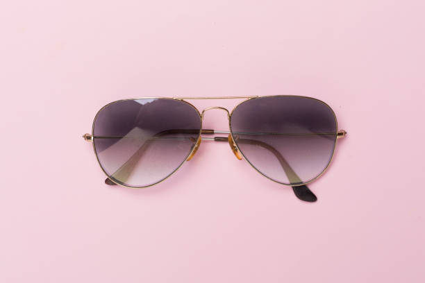 istock Sunglasses on color background, top view. 1947973518