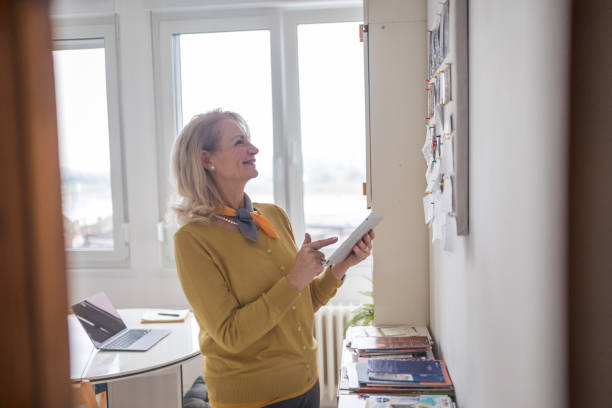 istock Senior woman planning her next vacation 1947975099